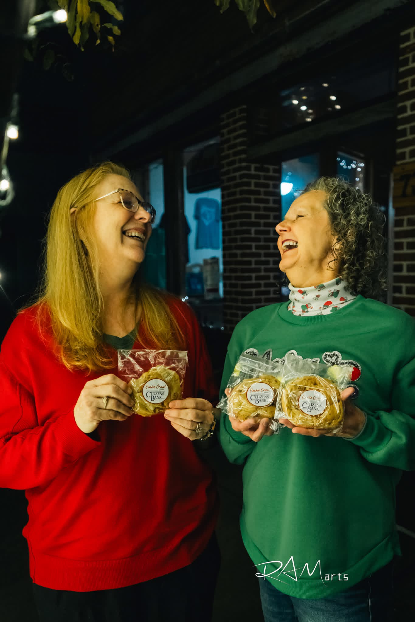 Neighbors laughing at a downtown holiday event