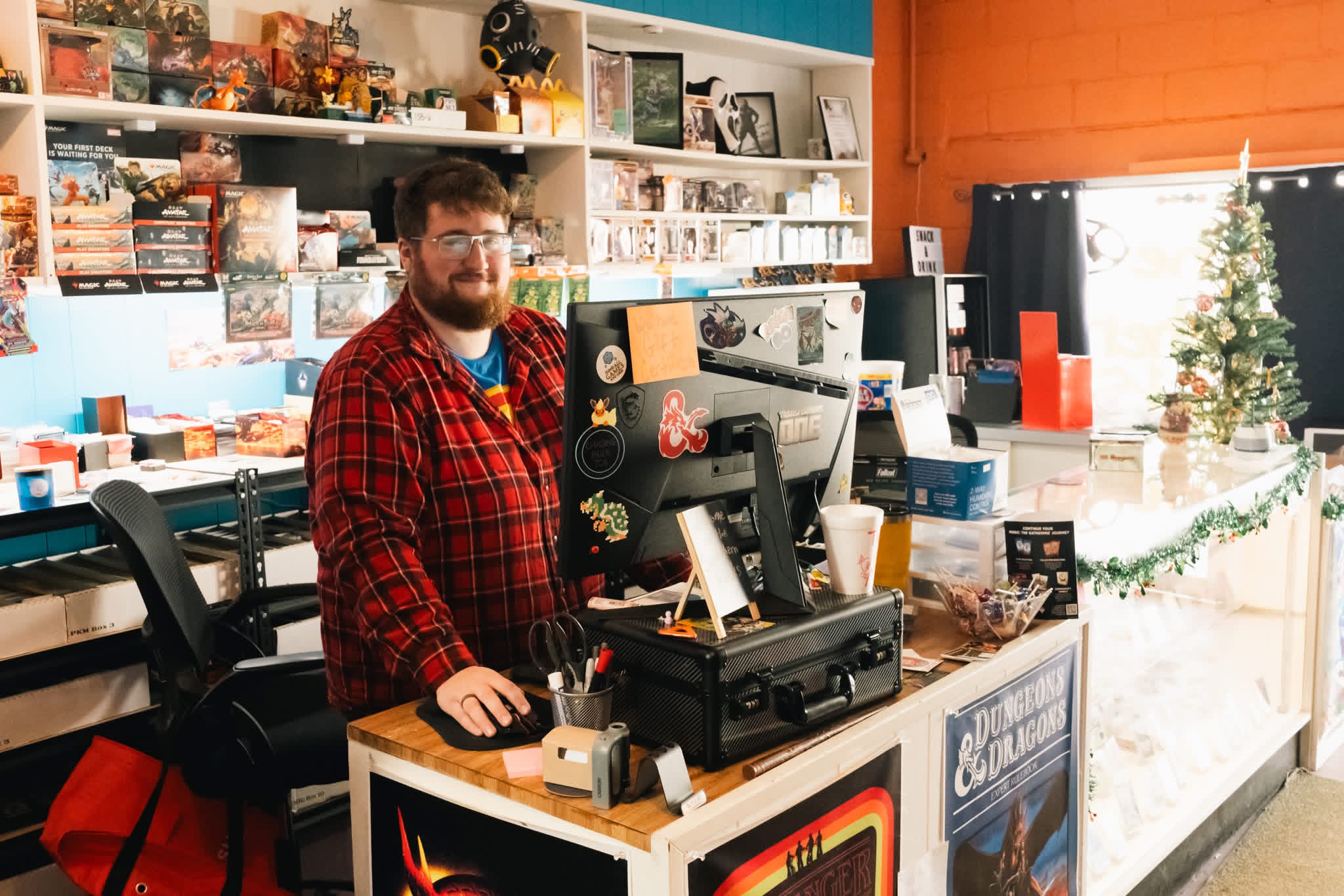 A local shop owner behind the counter of his downtown Columbia store
